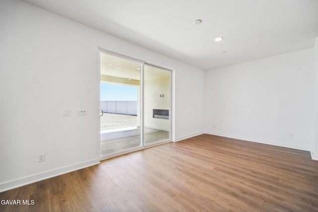 39635 Nicholas Ct, Palmdale, CA 93551 - empty room featuring wood finished floors and recessed lighting