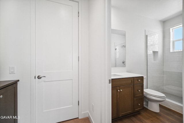 39635 Nicholas Ct, Palmdale, CA 93551 - bathroom featuring vanity, tiled shower, and wood finished floors