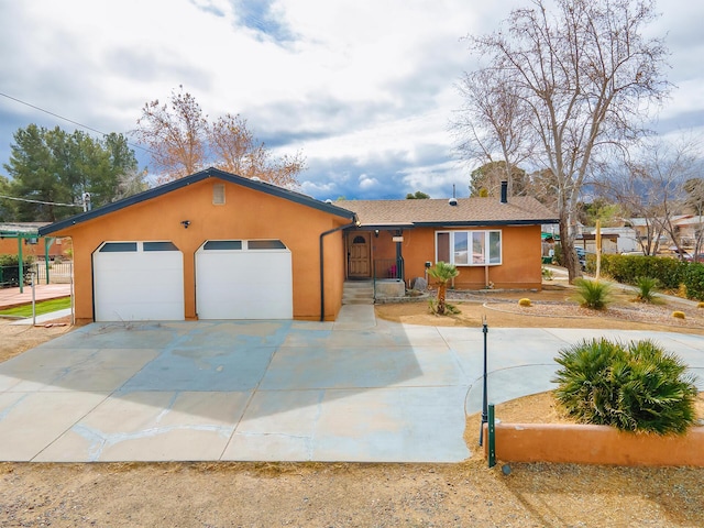 ranch-style house featuring a garage