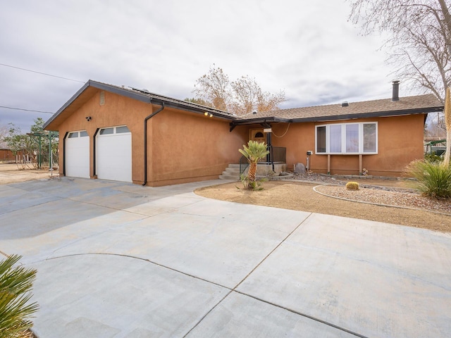 ranch-style house featuring a garage