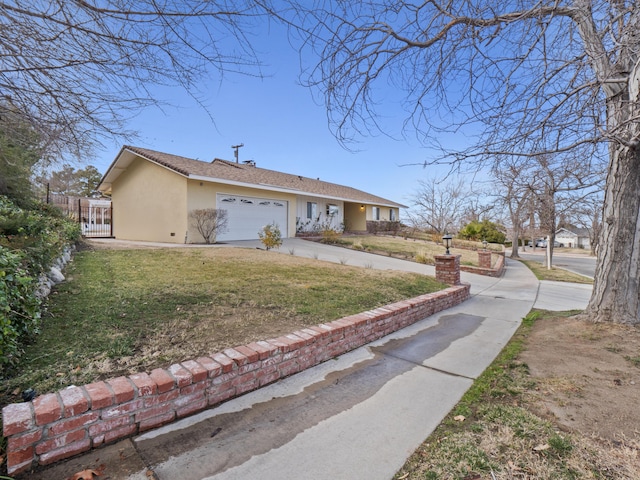 view of side of property with a garage and a yard