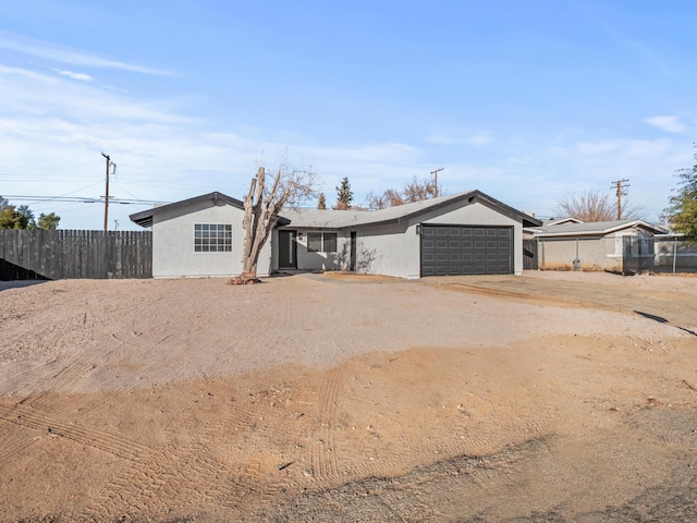 ranch-style house featuring a garage