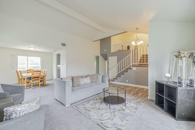 43661 Bravo Ln, Lancaster, CA 93535 - living room with stairs, beamed ceiling, a chandelier, carpet, and baseboards