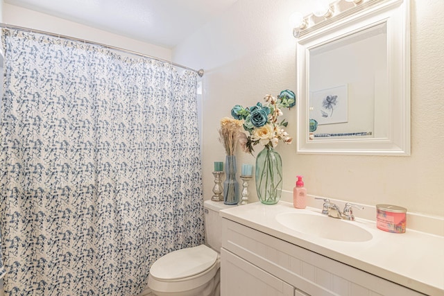 43661 Bravo Ln, Lancaster, CA 93535 - full bathroom featuring toilet, vanity, and a shower with shower curtain