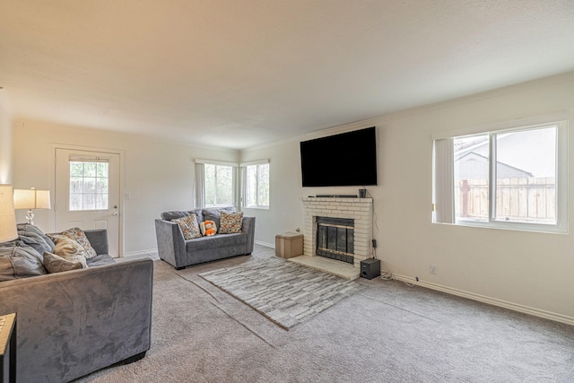 43661 Bravo Ln, Lancaster, CA 93535 - living area featuring carpet flooring, ornamental molding, a fireplace, and baseboards