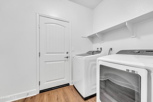 3932 Birchwood Ave, Rosamond, CA 93560 - laundry room with independent washer and dryer and light wood-style floors