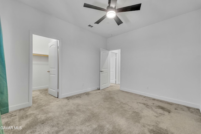 3932 Birchwood Ave, Rosamond, CA 93560 - unfurnished bedroom with carpet flooring, a spacious closet, a ceiling fan, and a closet