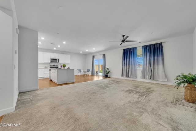 3932 Birchwood Ave, Rosamond, CA 93560 - unfurnished living room featuring recessed lighting, light carpet, and a ceiling fan