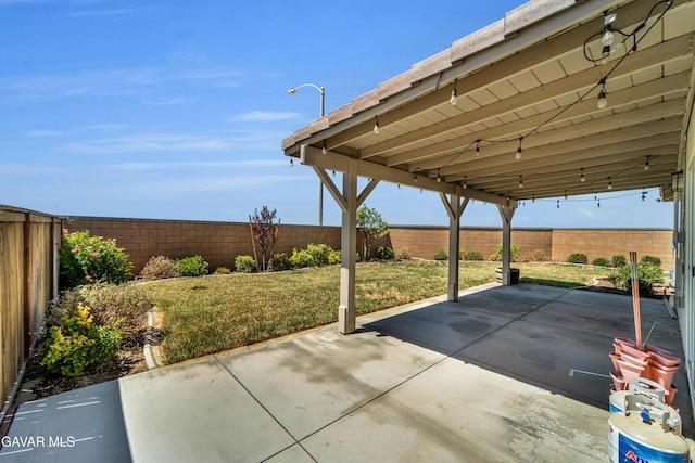 3932 Birchwood Ave, Rosamond, CA 93560 - fenced backyard featuring a patio area