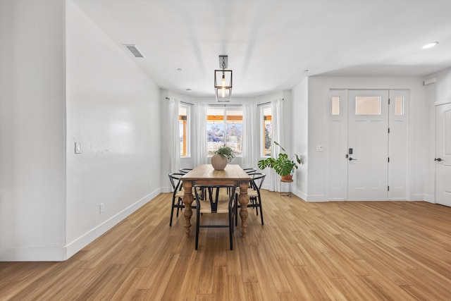 dining area featuring light wood-type flooring, visible vents, baseboards, and recessed lighting