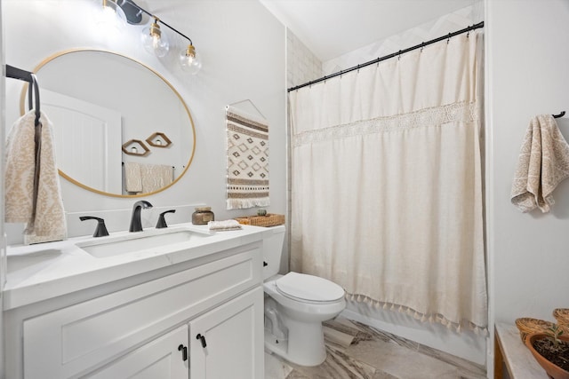 bathroom featuring marble finish floor, toilet, vanity, and shower / bath combo