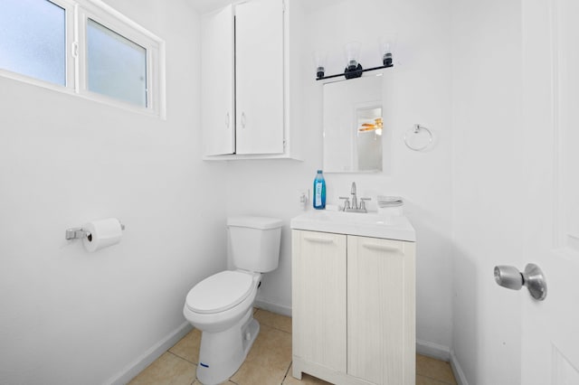 15872 Rexroth St, Mojave, CA 93501 - bathroom featuring toilet, vanity, baseboards, and tile patterned flooring