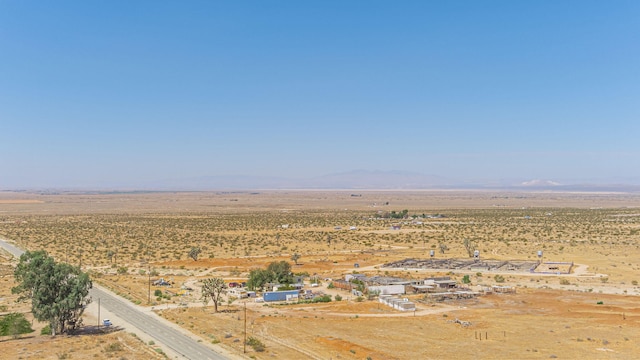 birds eye view of property with a rural view