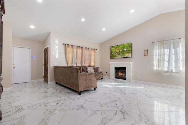 living room featuring a fireplace and vaulted ceiling