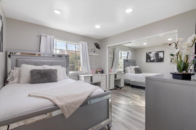 bedroom featuring a closet and light hardwood / wood-style floors