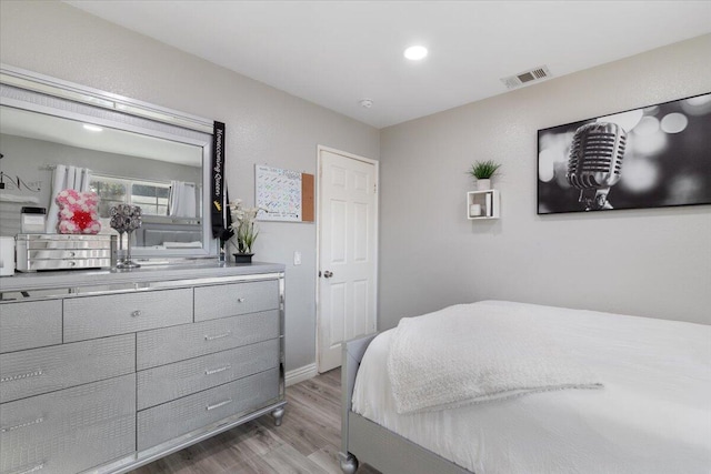 bedroom with wood-type flooring