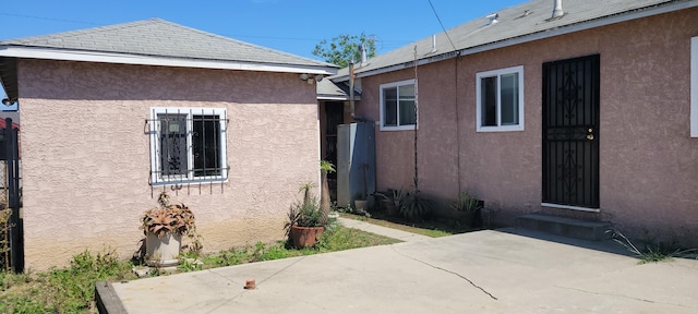 1103 W Bennett St, Compton, CA 90220 - view of side of property featuring a patio area and stucco siding