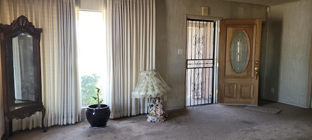 1103 W Bennett St, Compton, CA 90220 - entrance foyer with carpet floors and wooden walls