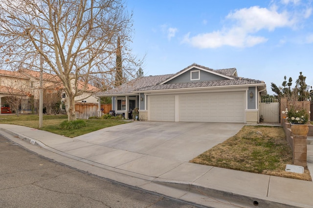 ranch-style home featuring a garage and a front yard