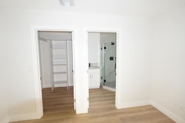 unfurnished bedroom featuring light wood-type flooring