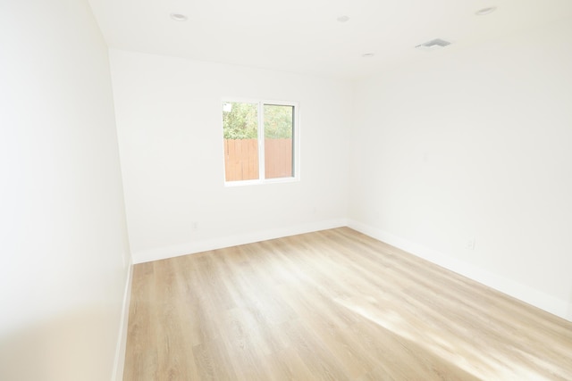 unfurnished room featuring light hardwood / wood-style floors