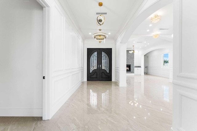 42730 W 23rd St, Lancaster, CA 93536 - entrance foyer featuring french doors, ornamental molding, and a fireplace