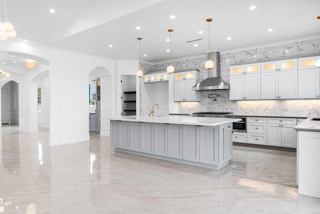 42730 W 23rd St, Lancaster, CA 93536 - kitchen with a spacious island, wall chimney exhaust hood, sink, crown molding, and hanging light fixtures