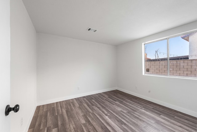 empty room with hardwood / wood-style floors