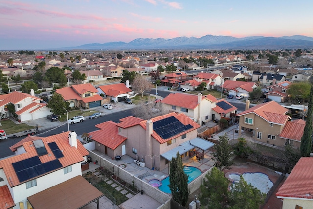 aerial view at dusk with a mountain view