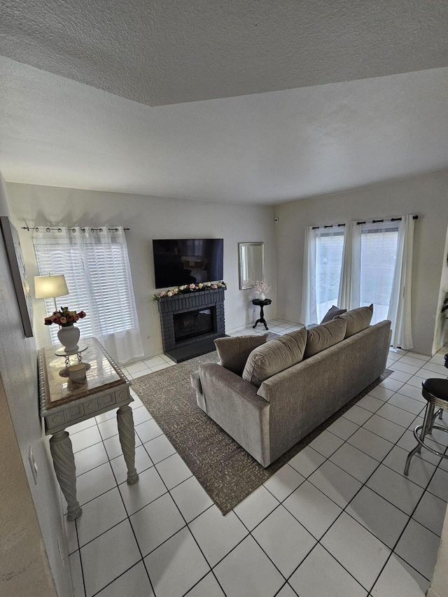 403 Sunrise Ter, Palmdale, CA 93551 - living room with light tile patterned floors, a wealth of natural light, and a fireplace