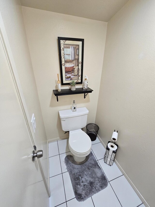 403 Sunrise Ter, Palmdale, CA 93551 - bathroom featuring tile patterned floors, baseboards, and toilet