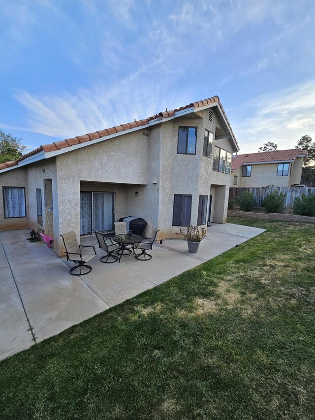 403 Sunrise Ter, Palmdale, CA 93551 - back of property with fence, a patio, stucco siding, a yard, and a tile roof