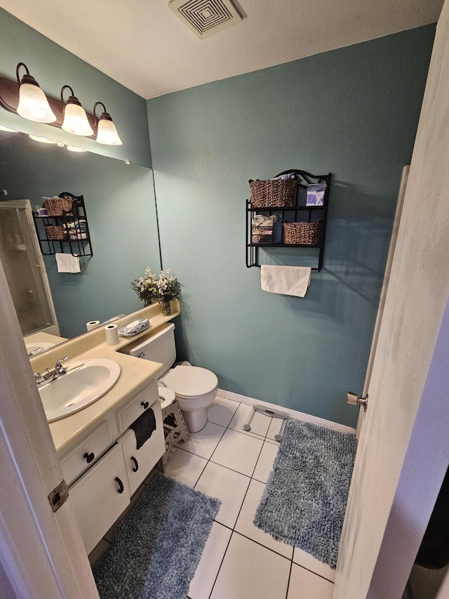 403 Sunrise Ter, Palmdale, CA 93551 - bathroom with visible vents, tile patterned flooring, a stall shower, vanity, and toilet