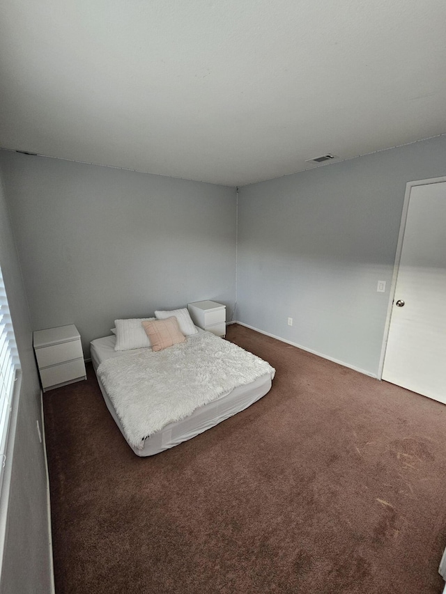 403 Sunrise Ter, Palmdale, CA 93551 - bedroom featuring carpet floors, baseboards, and visible vents