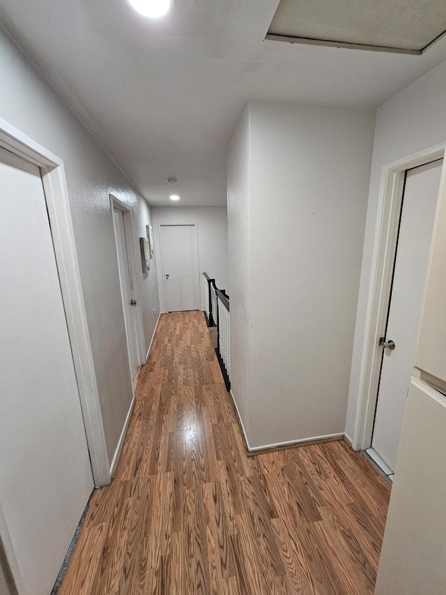 403 Sunrise Ter, Palmdale, CA 93551 - corridor with baseboards, wood finished floors, and an upstairs landing