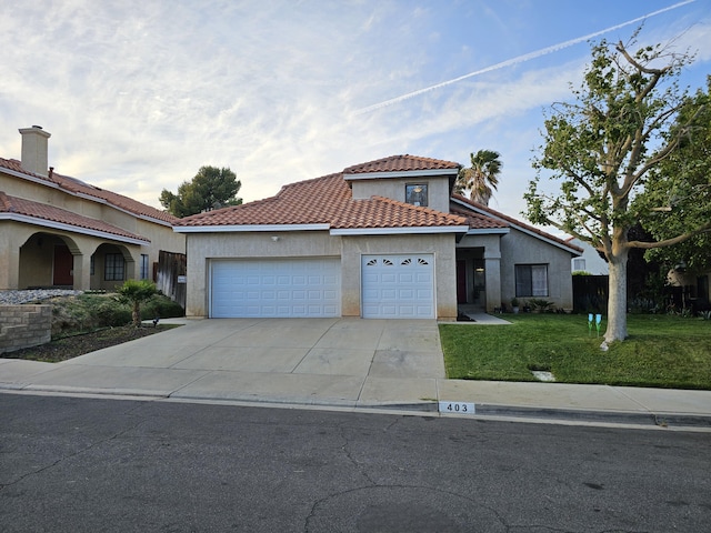 403 Sunrise Ter, Palmdale, CA 93551 - mediterranean / spanish-style house featuring a front lawn, a garage, stucco siding, a tiled roof, and driveway
