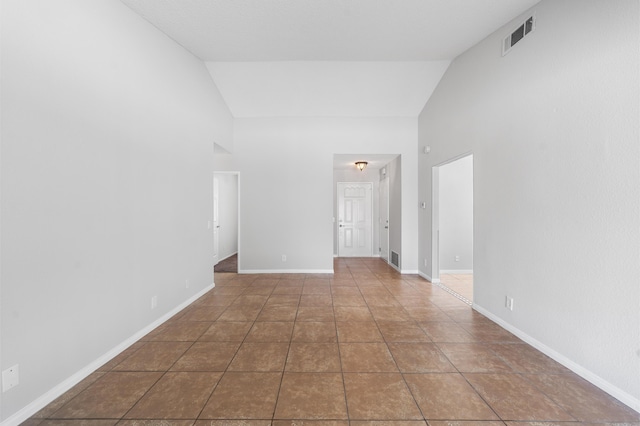 38115 E 41st St, Palmdale, CA 93552 - unfurnished room with high vaulted ceiling, tile patterned floors, and baseboards