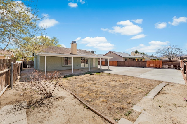 38115 E 41st St, Palmdale, CA 93552 - rear view of property with a patio, a fenced backyard, and a chimney