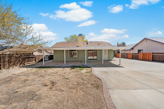 38115 E 41st St, Palmdale, CA 93552 - back of house featuring a patio area, a chimney, and a fenced backyard