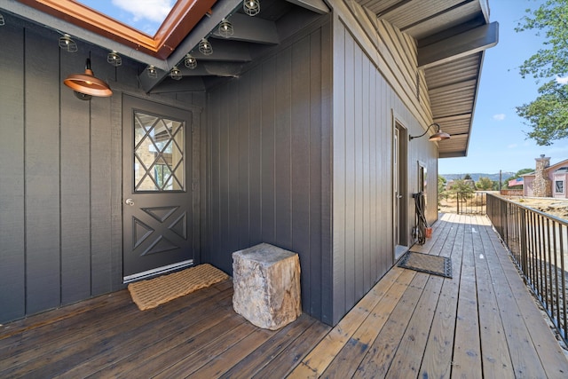 view of exterior entry featuring a balcony