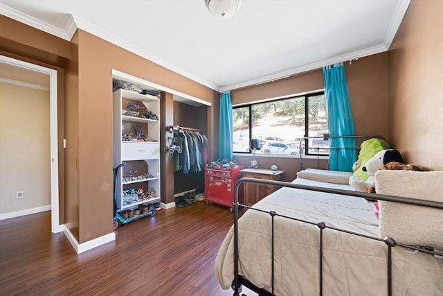 bedroom featuring dark hardwood / wood-style flooring, a closet, and ornamental molding