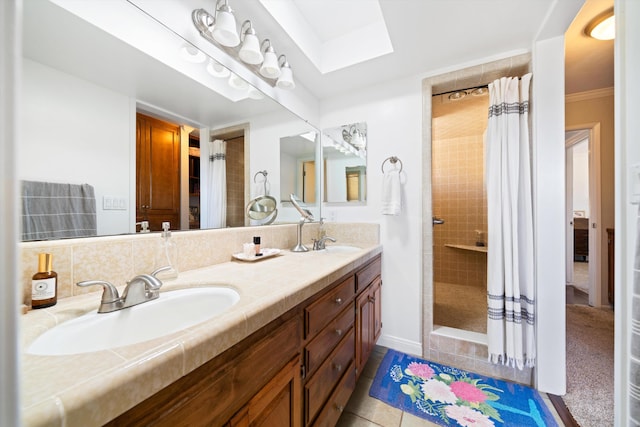 bathroom with a shower with shower curtain, vanity, and tile patterned flooring