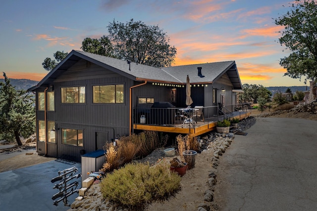 view of front of house featuring a patio area and a wooden deck