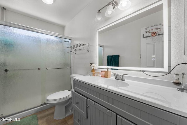 43656 E 5th St, Lancaster, CA 93535 - bathroom with vanity, a stall shower, and wood finished floors