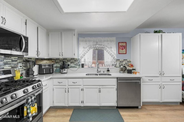 43656 E 5th St, Lancaster, CA 93535 - kitchen featuring stainless steel appliances, white cabinetry, and light countertops
