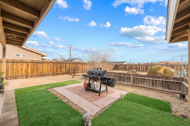 view of yard featuring a patio and a fenced backyard