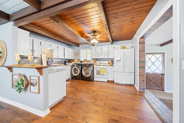 kitchen with white cabinets, tasteful backsplash, white appliances, and wooden ceiling