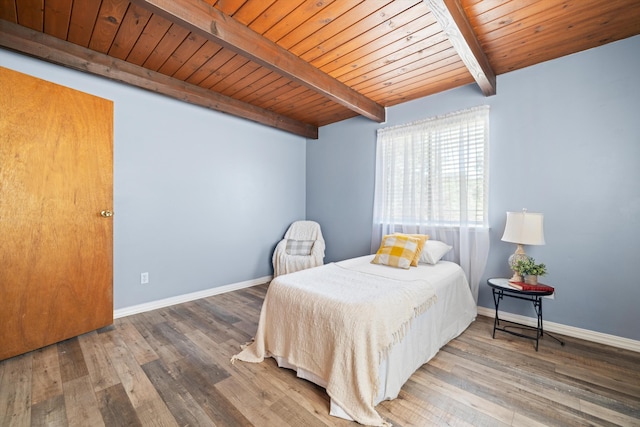 bedroom featuring beamed ceiling, wooden ceiling, and wood-type flooring