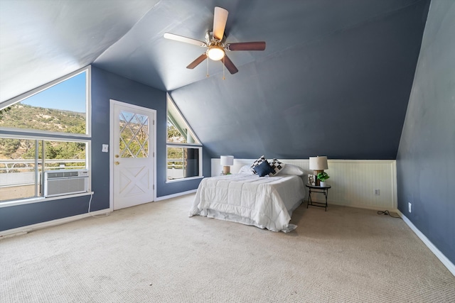 bedroom featuring carpet floors, vaulted ceiling, ceiling fan, and cooling unit