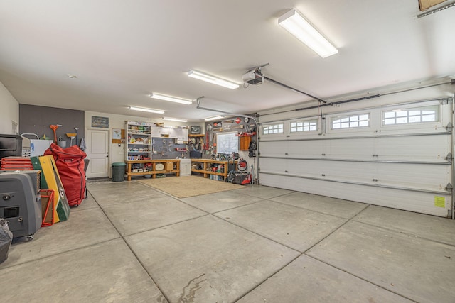 garage featuring a workshop area and a garage door opener